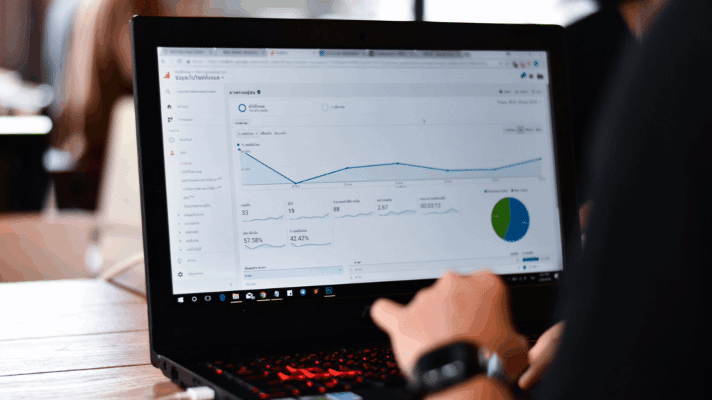 person looking on laptop showing google analytic dashboard
